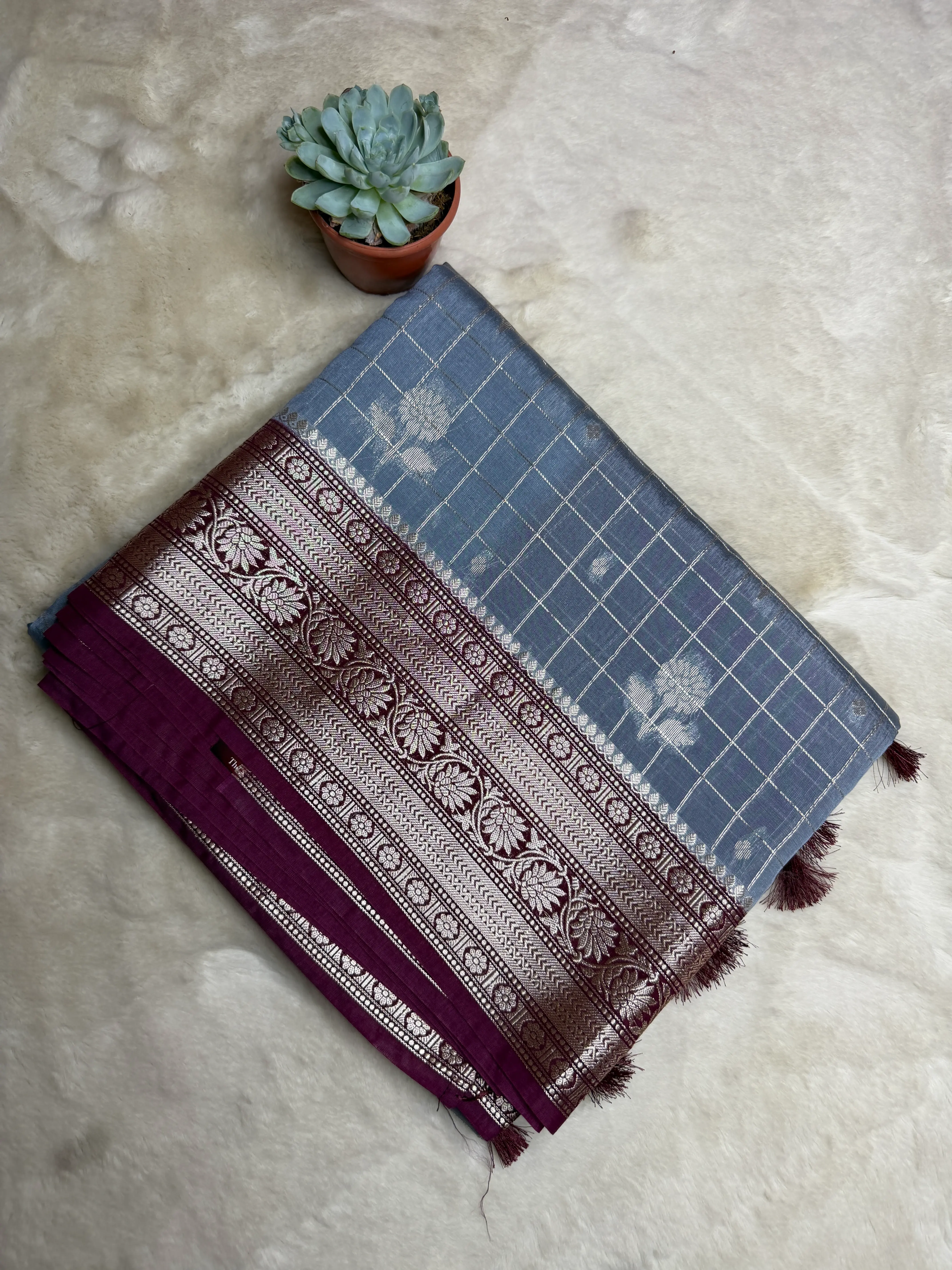 Checks with grand border and pallu semi crepe fancy saree