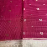 Red with Cream Microchecks all over the body with peacock motifs semi crepe saree