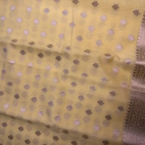 Lemon yellow with buttas chiffon saree