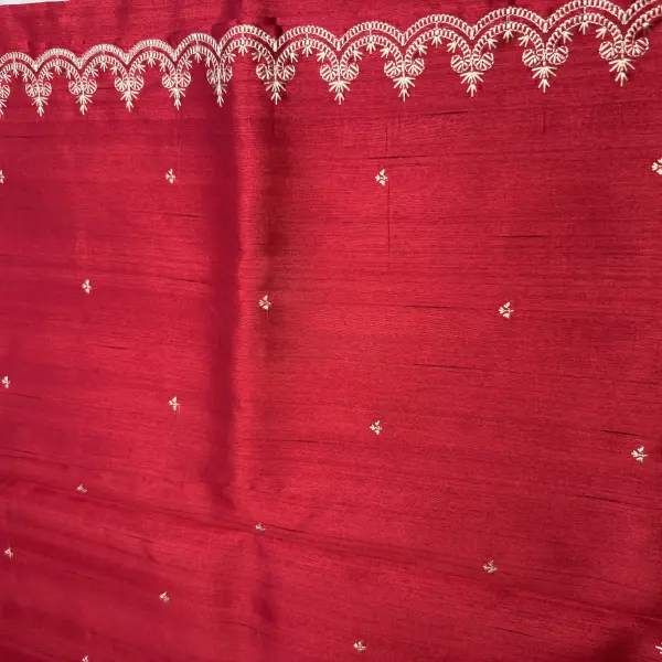 Cherry red with thread work all over raw silk saree