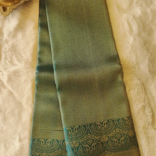 Dark green all over zari body with contemporary border silk sarees