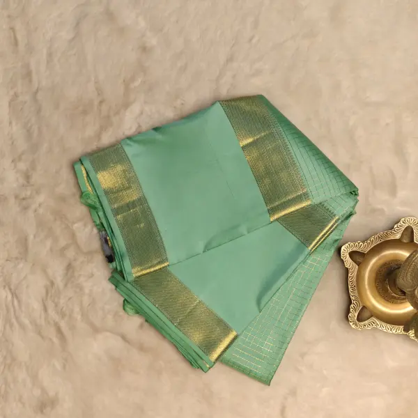 Pastel Green microchecks with bentex border pure silk saree
