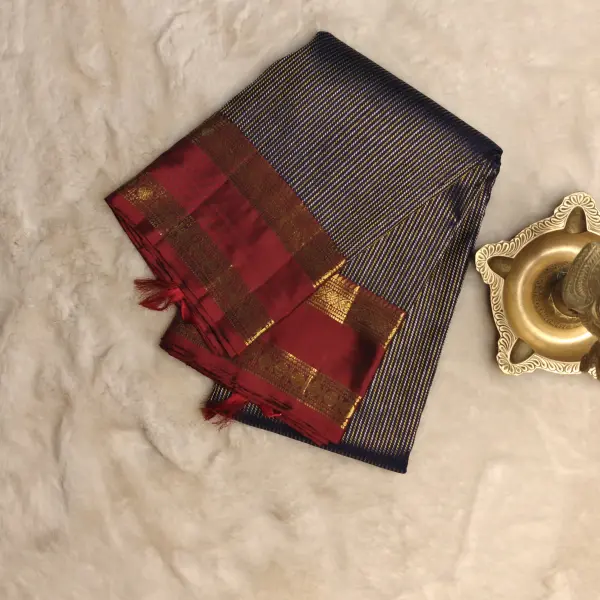 Navy blue with gold and silver verticle lines red border pure silk saree