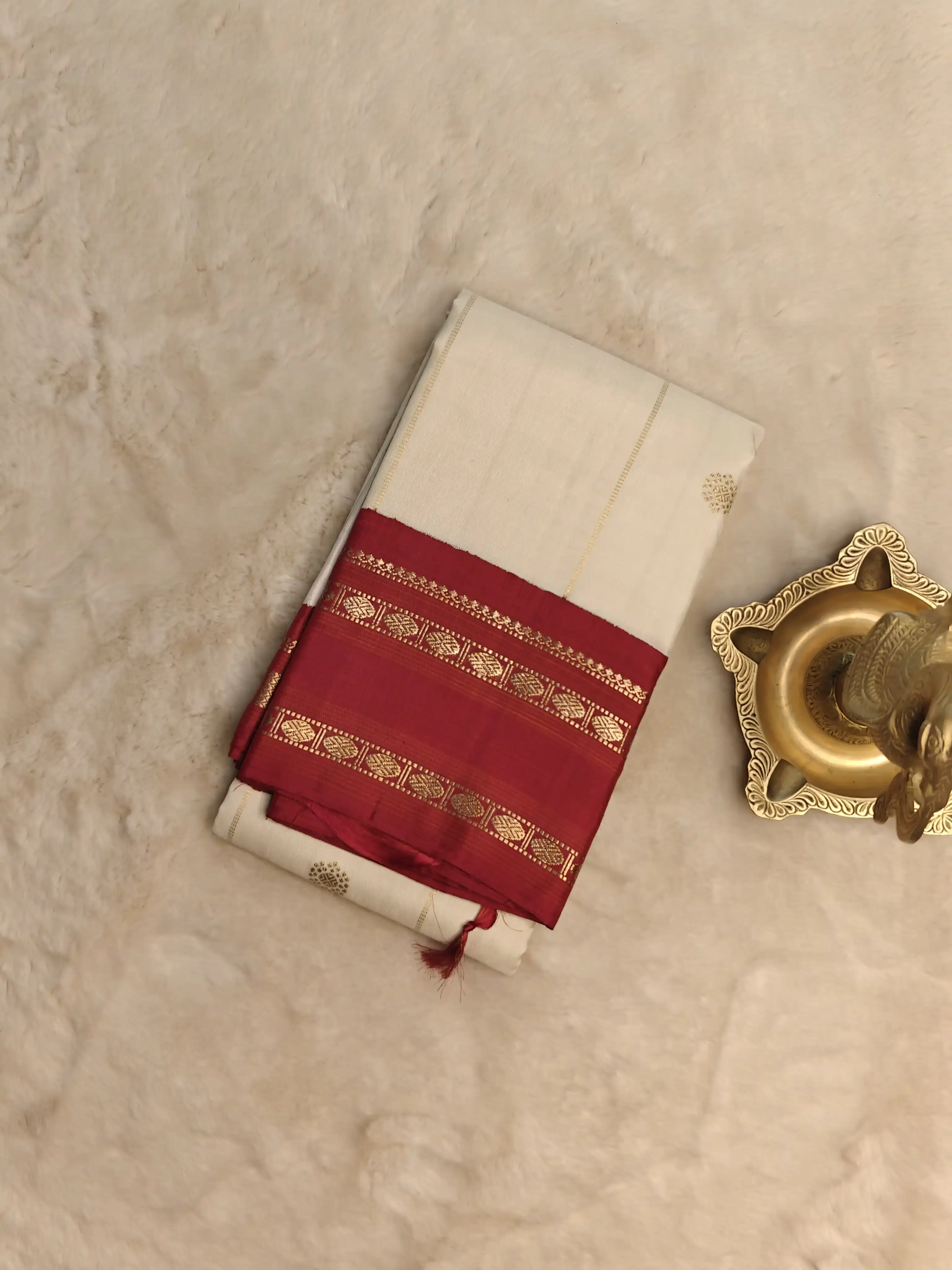 Cream checks with small motifs and red border traditional silk saree