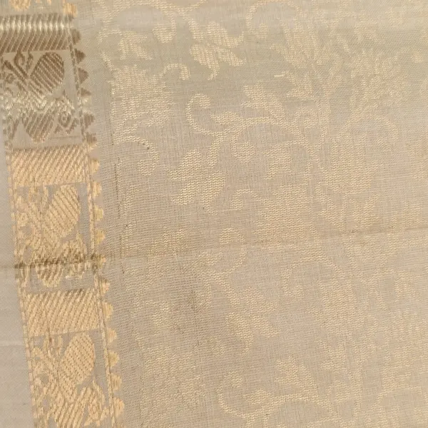 Cream Self design jaal pattern with peacock motif soft silk saree