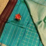 Brown checks with blue contrast peacock border silk saree