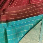 Brown checks with blue contrast peacock border silk saree