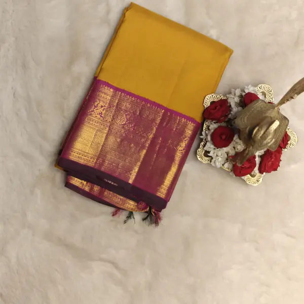 Mustard yellow with pink border silk saree