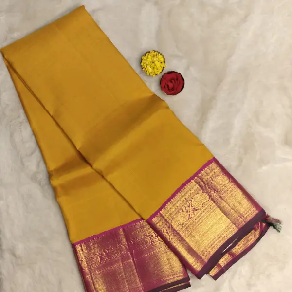 Mustard yellow with pink border silk saree