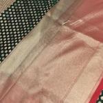 Green and red border with all over buttas benaras saree