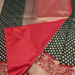 Green and red border with all over buttas benaras saree
