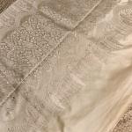 Cream self design motifs rich border and pallu benaras saree