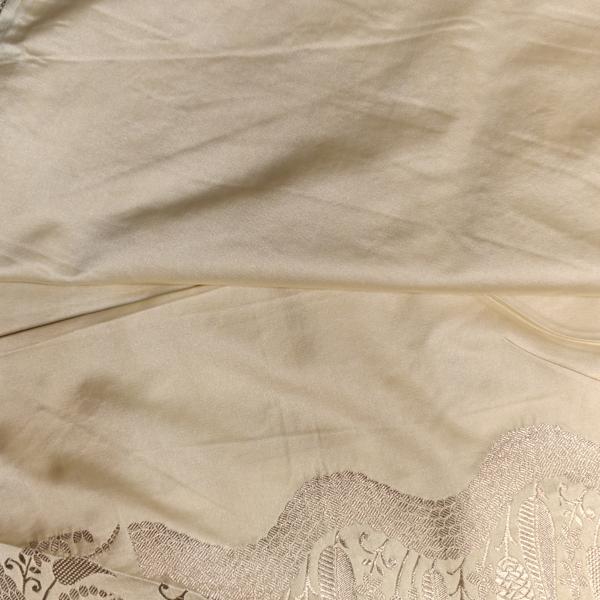 Cream self design motifs rich border and pallu benaras saree